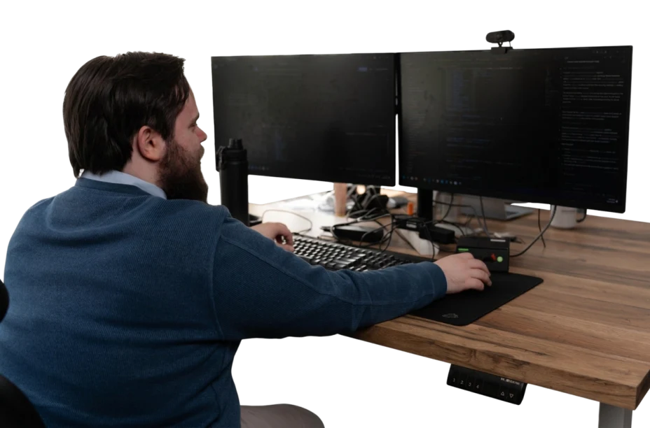 WD Market developer working at a dual-monitor desk